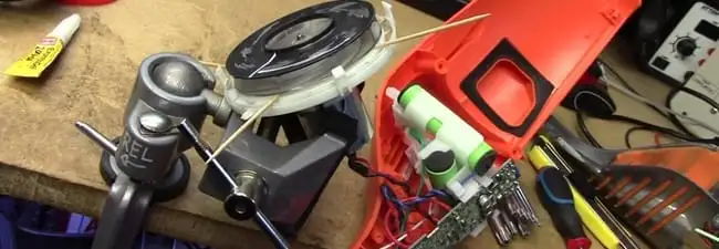 Vacuum cleaner repair parts and tools on a workbench in Pembroke Pines, FL