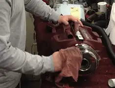 Vacuum repair technician cleaning and servicing a vacuum motor in Pembroke Pines, FL